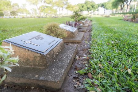 Bigstock-Graves-In-Graveyard-With-Beaut-336816622.jpg